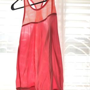Pinkish orange workout tank.